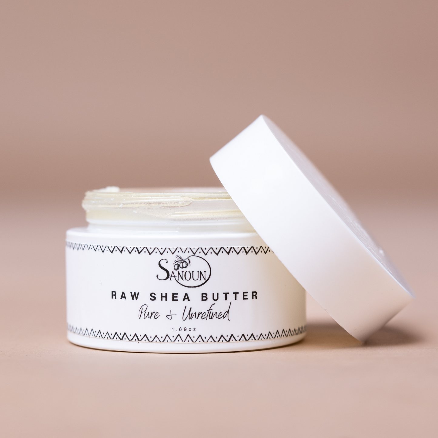 Small jar of Sanoun mini raw shea butter ideal for travel