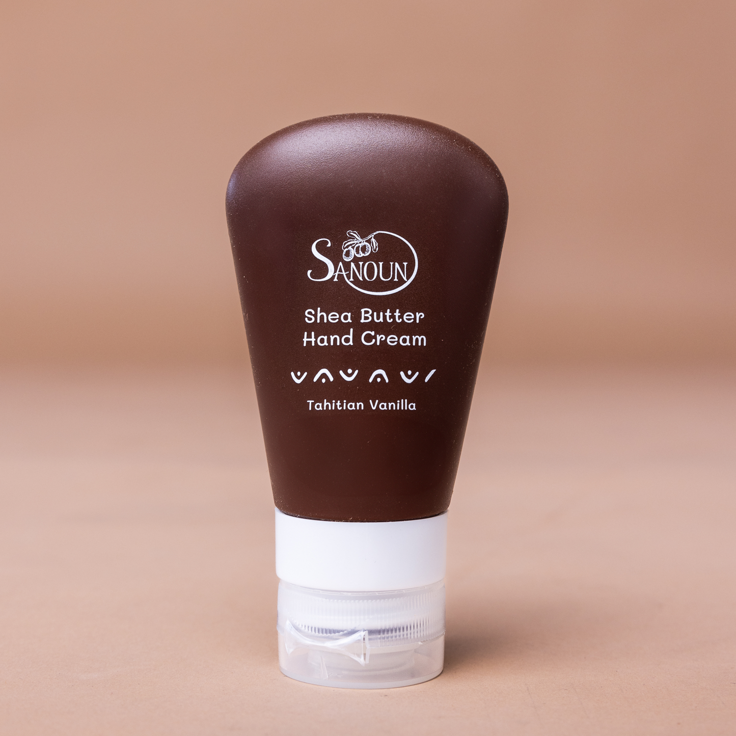 Brown tube of Tahitian Vanilla Hand Cream with vanilla flower accents.