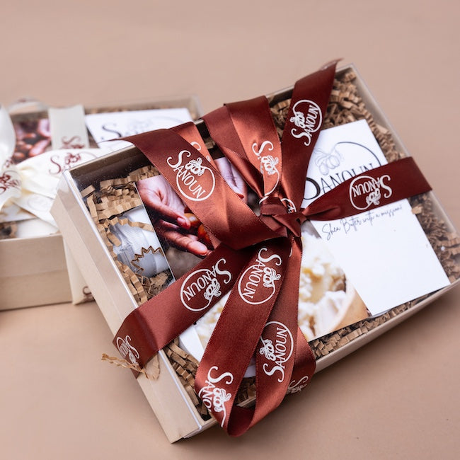 Elegant gift box tied with ribbon containing three Sanoun skincare minis