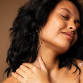 woman applying lafia body creme