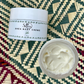 Close up of Lafia Shea Body Creme jar and texture.