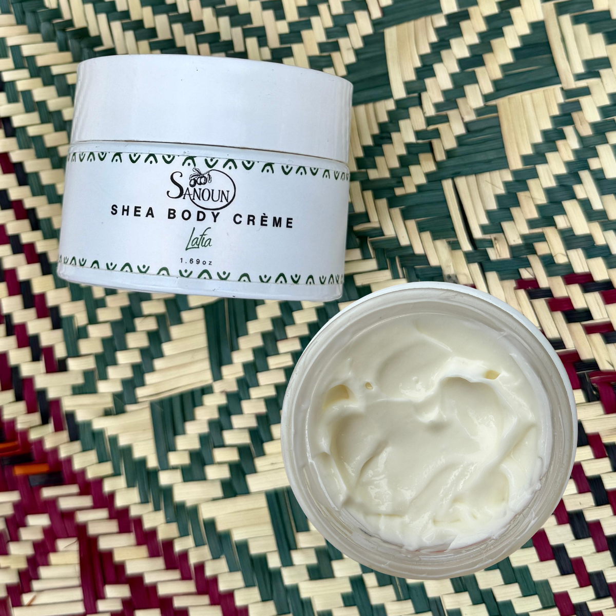 Close up of Lafia Shea Body Creme jar and texture.