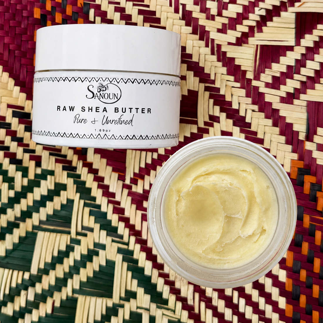 Mini Raw Shea Butter jar with open butter texture on a woven Malian mat